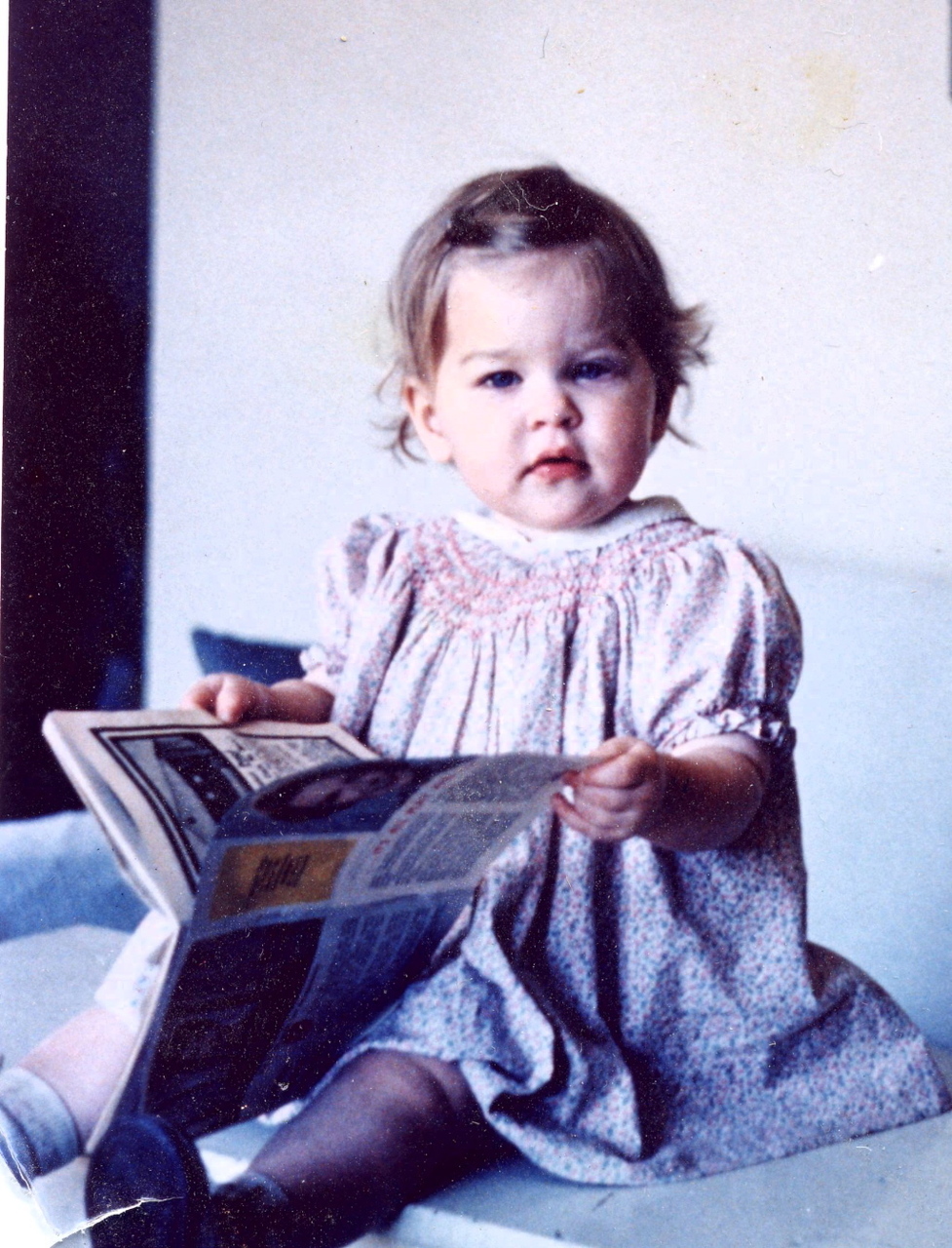 At 15 months old, getting a head start on my book career.